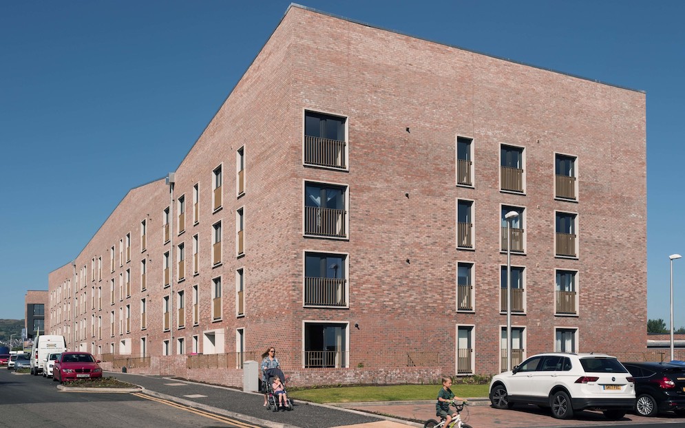Photo of a block of 52 flats with red brick exterior